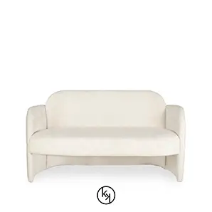 Soft, white, textured Oh-la-la sofa with rounded edges and armrests, isolated on a white background.