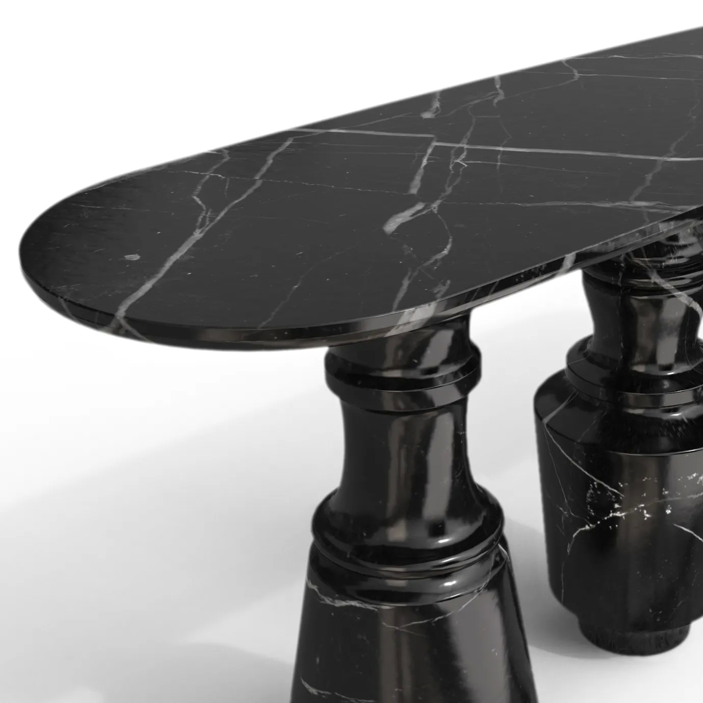 Close-up of the black marble oval top of the Pietra Nero Marquina Console table, showing its veining.