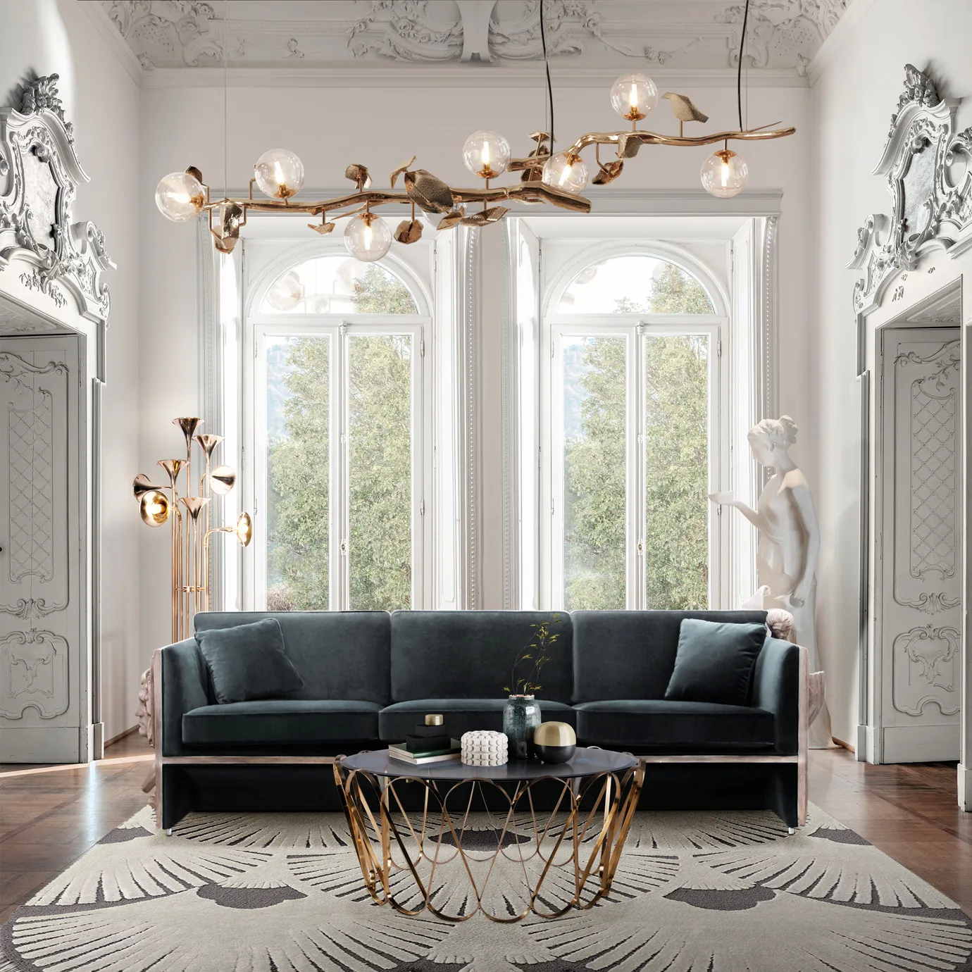Hera Chandelier in a stylish living room with a dark blue velvet sofa and geometric coffee table.