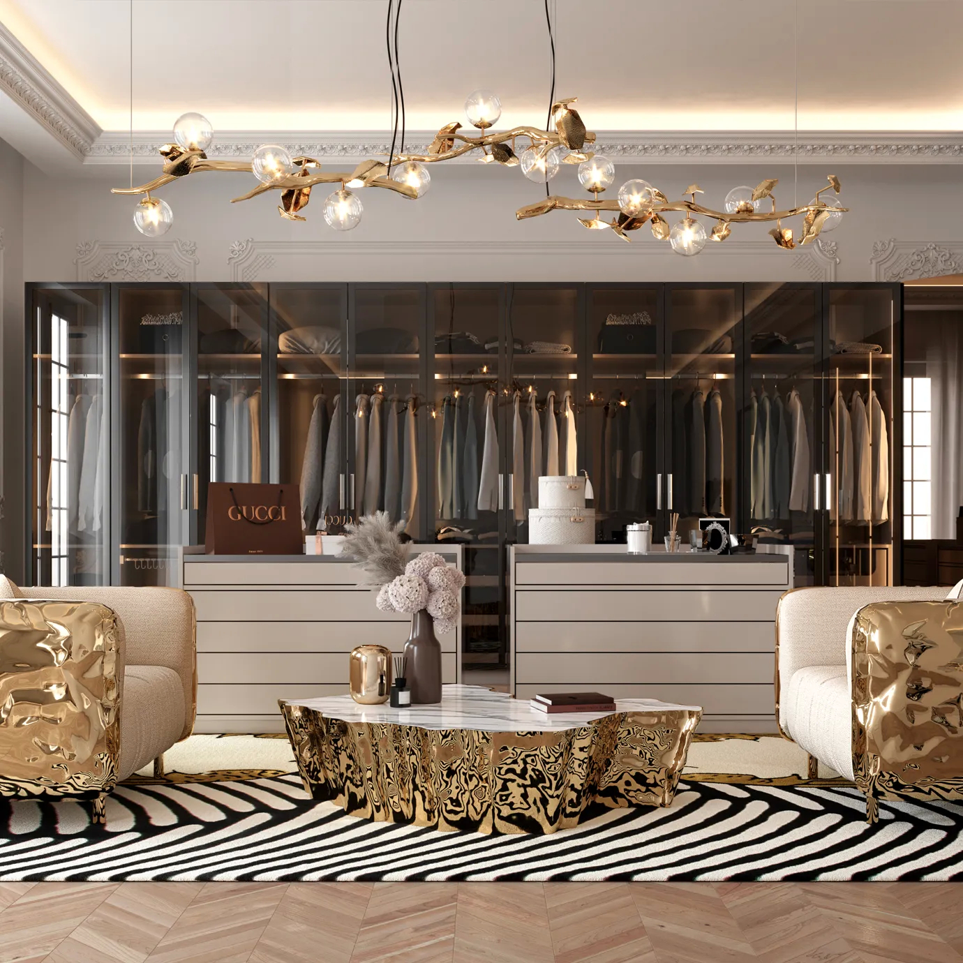 The Hera Chandelier illuminates a modern living room with a dark blue velvet sofa.