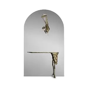 Lumiere Console with an elegant, arched mirror and gold accents, featuring a vintage-style lamp and ornate design.