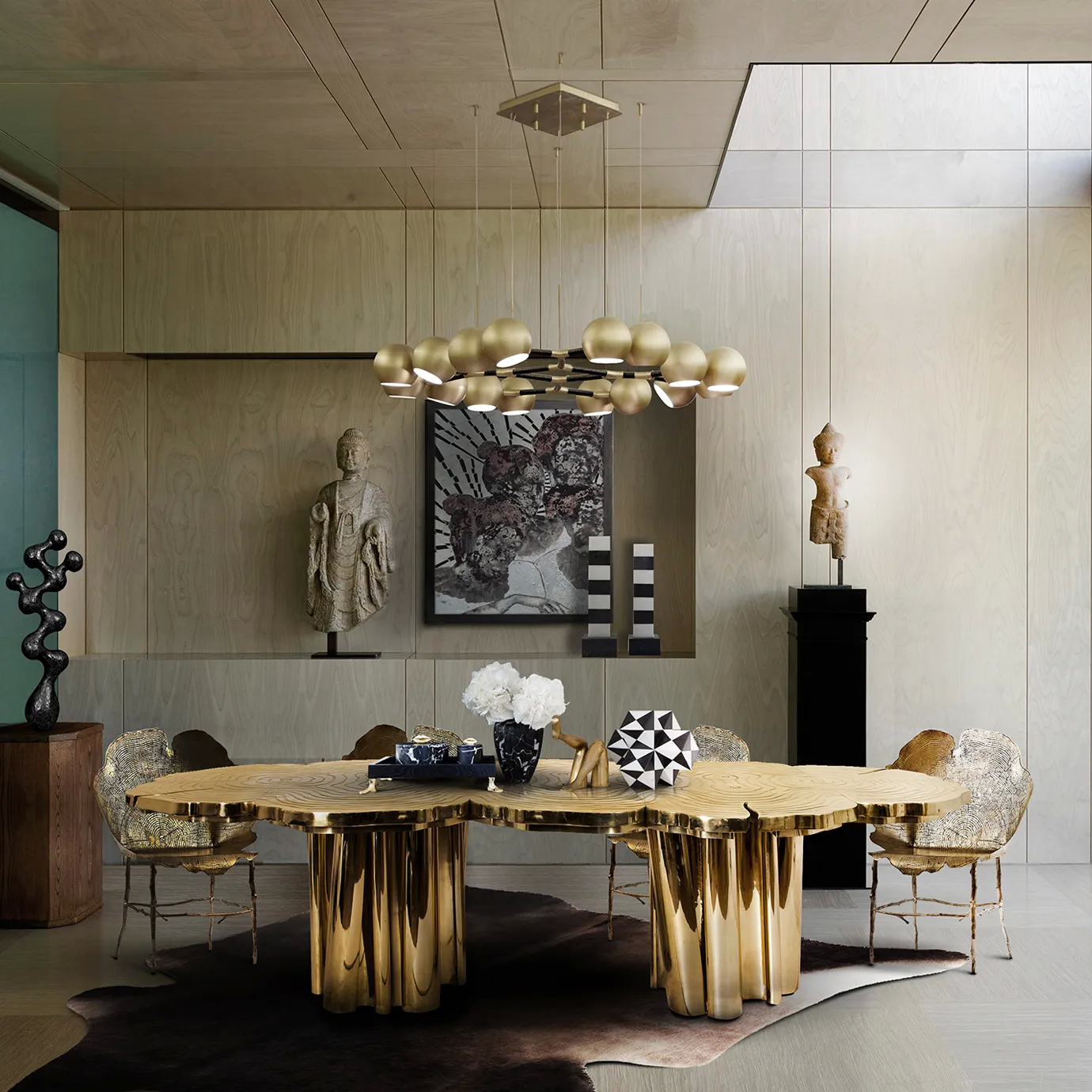 Fortuna Dining Table styled in a modern dining room with gold accents, artful decor, and elegant seating.