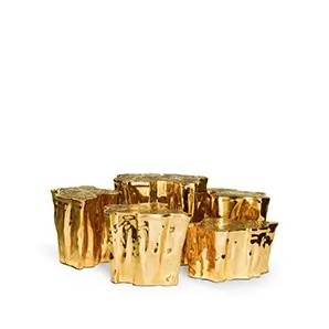 Luxurious Eden Center Table set, showcasing its unique, high-shine golden tree trunk design.