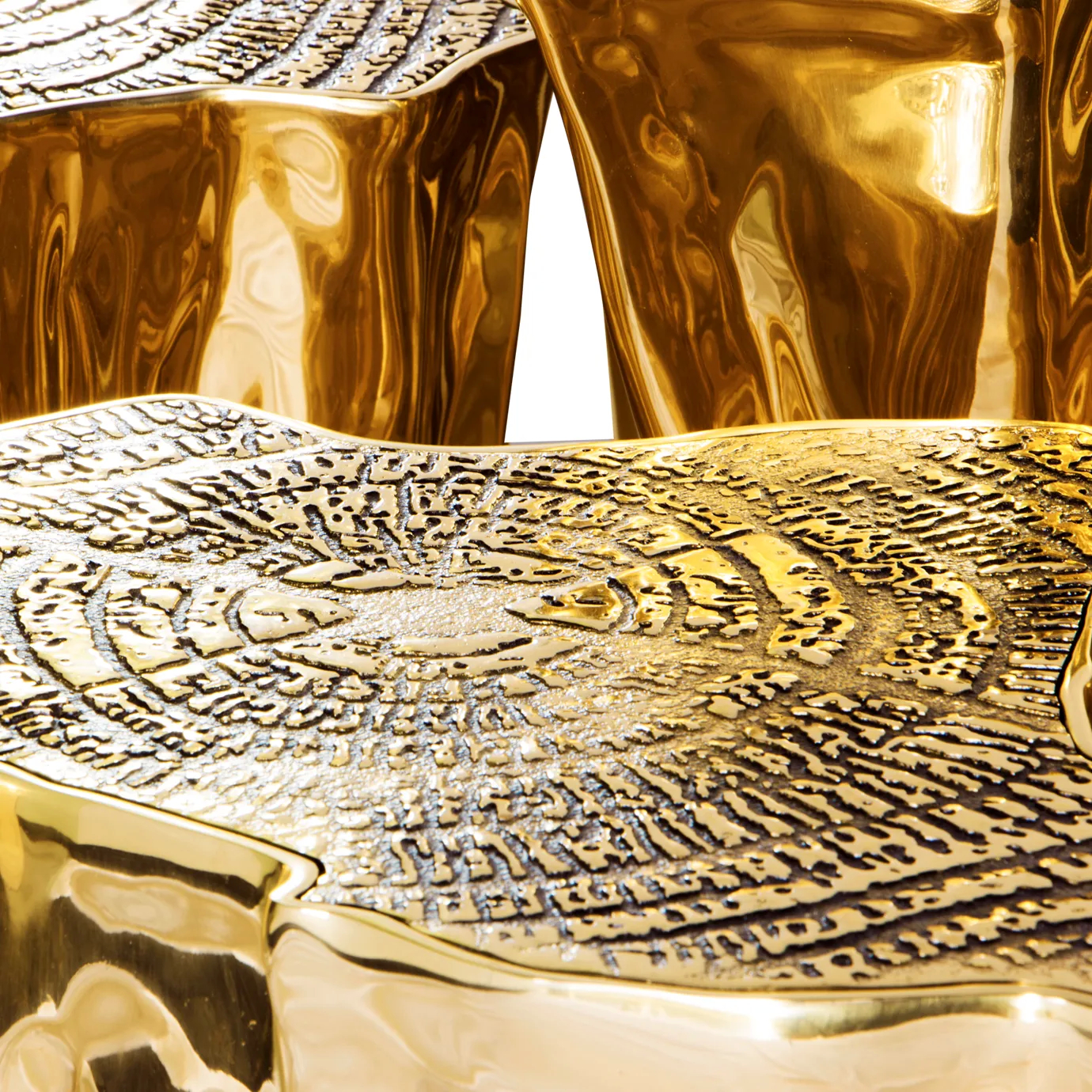 Close-up of the luxurious Eden Series Center Table, showcasing its textured, high-shine golden surface.