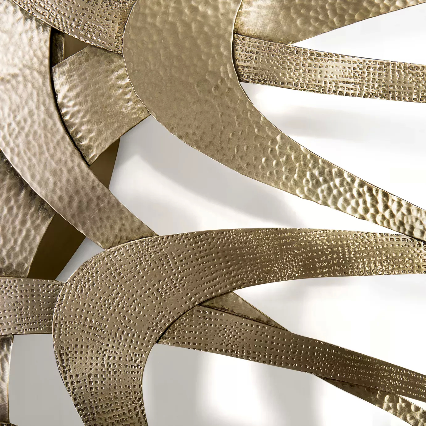 Elegant close-up of the textured golden tone details of the Guilt Mirror.