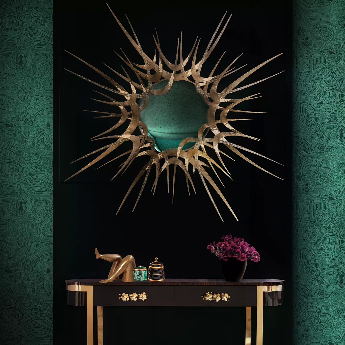 Elegant Guilt Mirror with dramatic golden sunburst design above a dark console table with golden details in a sophisticated setting.