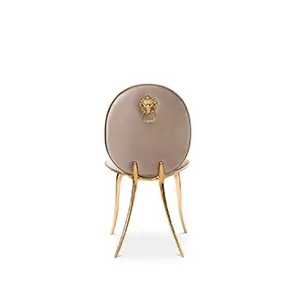 Cream Soleil chair with polished brass legs and curved backrest.