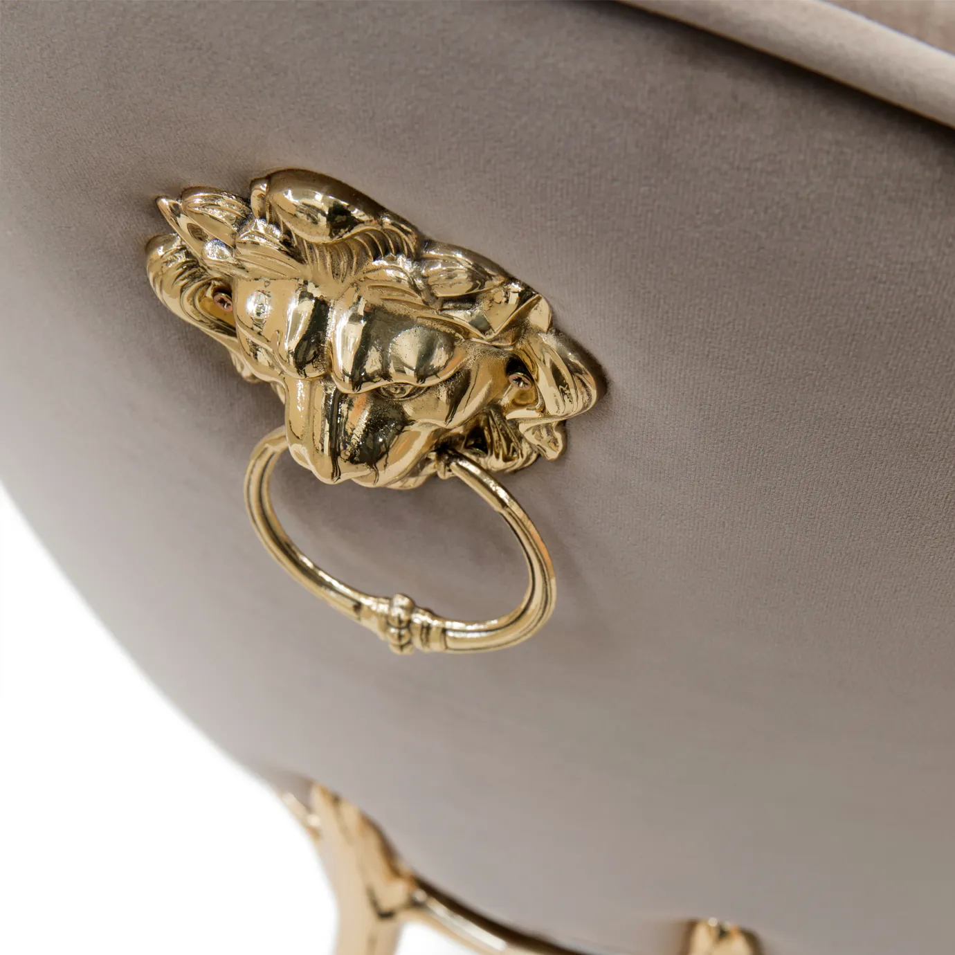 Cream Soleil chair with curved backrest and polished brass legs.