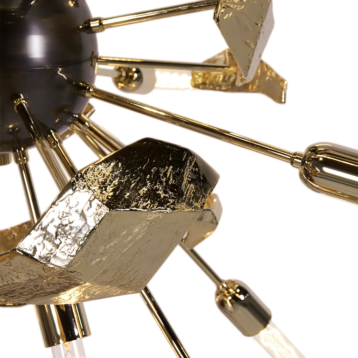 Close-up detail of the Supernova chandelier, showcasing its radiating metal arms, polished finish, and sculptural design for a striking contemporary lighting centerpiece