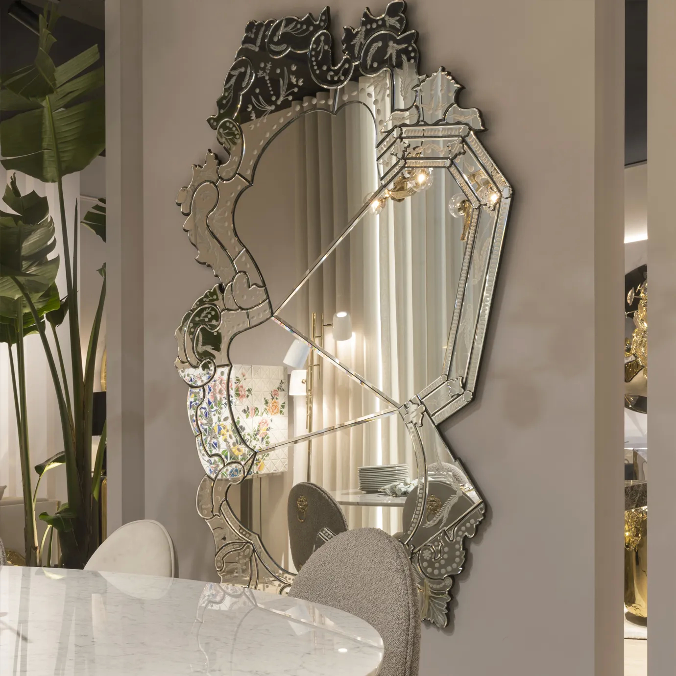 Venetian mirror with ornate gold frame displayed in a stylish bedroom, showcasing classic elegance and decorative sophistication
