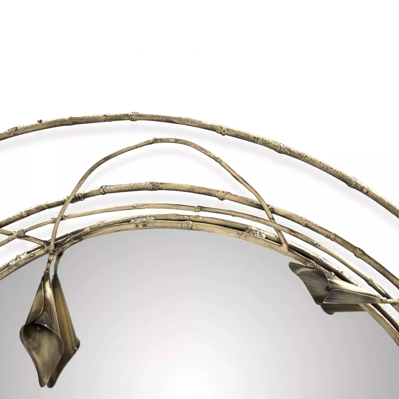 Detail of the Stella Mirror, highlighting two copper-collored Calla Lilies over the reflective surface.