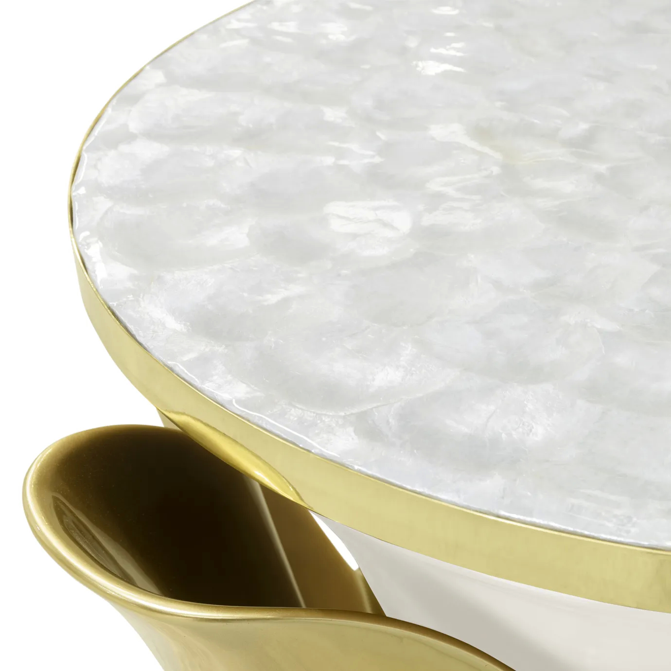 Detailed view of the Yasmine Mother of Pearl Side Table, showcasing its mother of pearl tabletop with golden edges and the golden structure attached to the cream base.