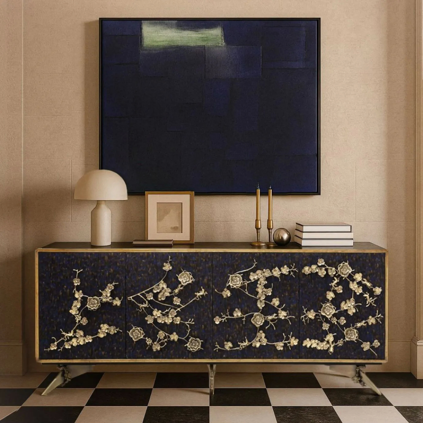 KOKET Spellbound Cabinet in peacock purple feathers with decorative brass flower branches and a gold-leaf frame, set against a neutral wall with high-contrast decor.