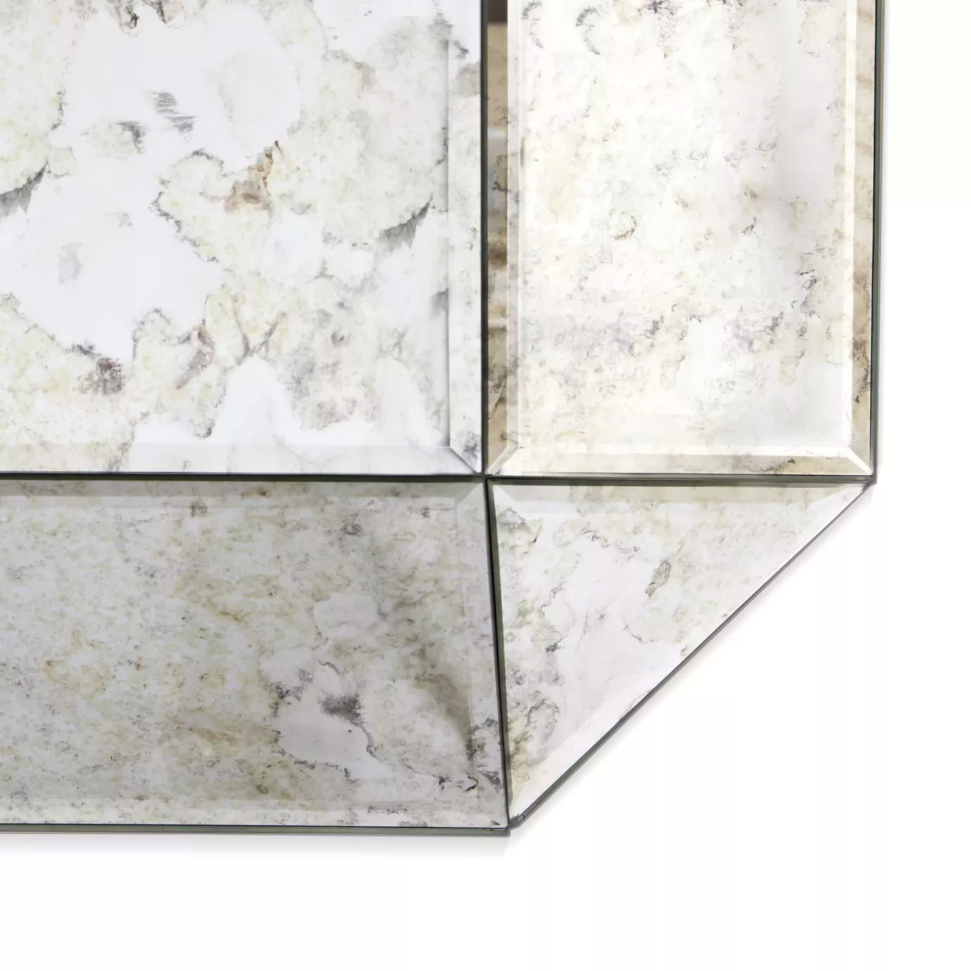 Elegant close-up of the corner with aged mirror of the Tamara Square Mirror.