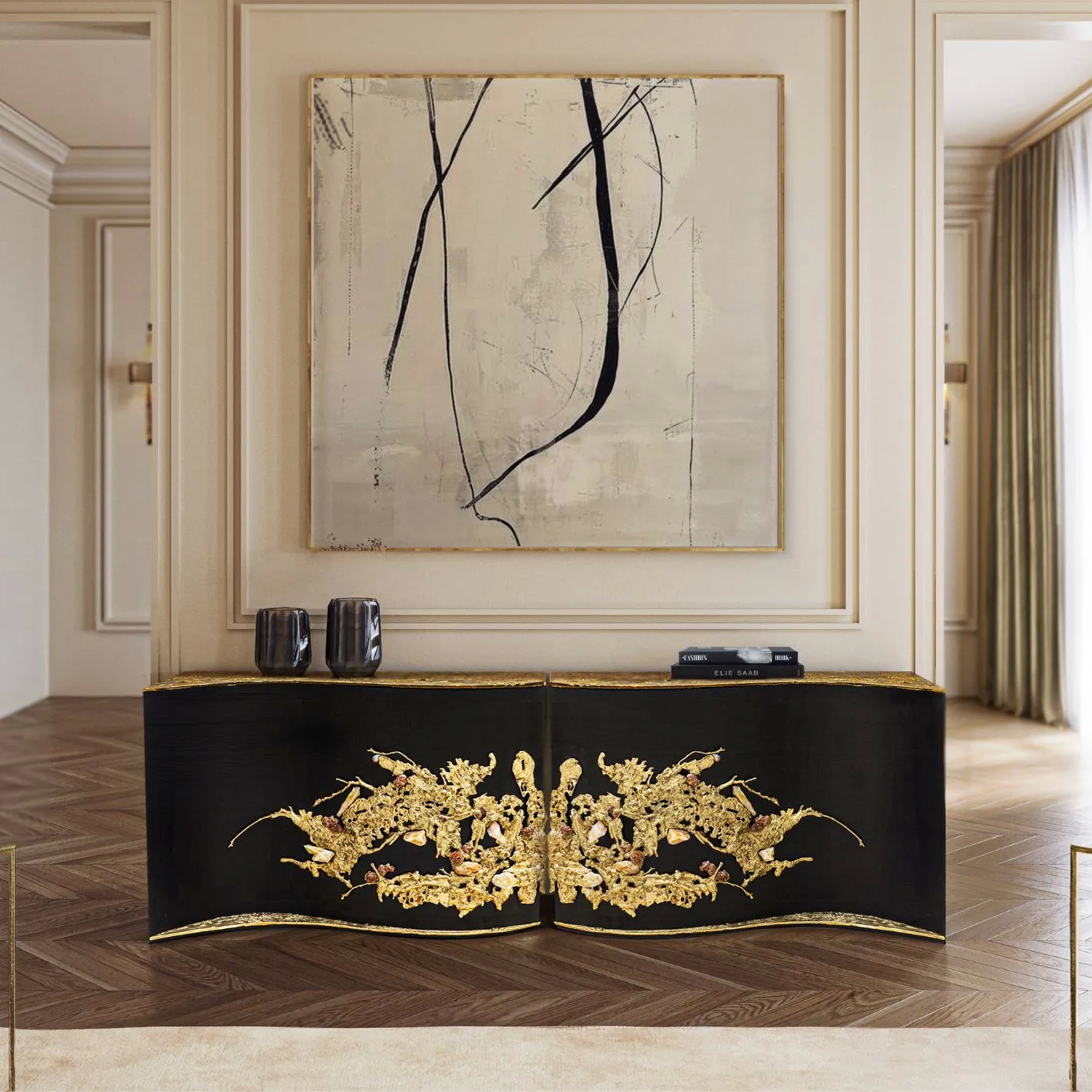 KOKET Empress Console in black lacquer with a striking central brass adornment, styled in a sophisticated neutral interior with minimalist art.