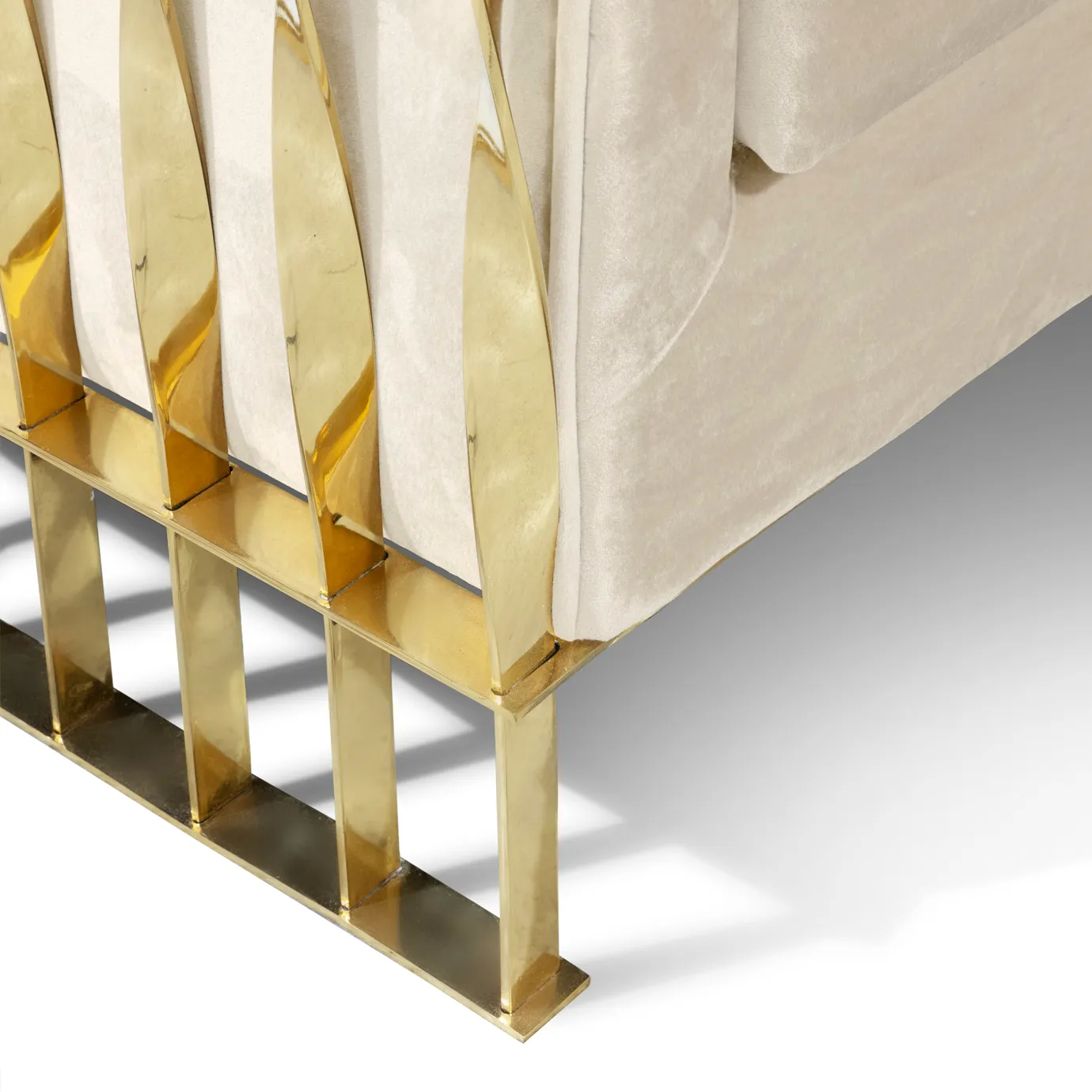 Close-up detail of the legs of Mandy armchair, featuring elegant gold accents and a sleek, modern design.