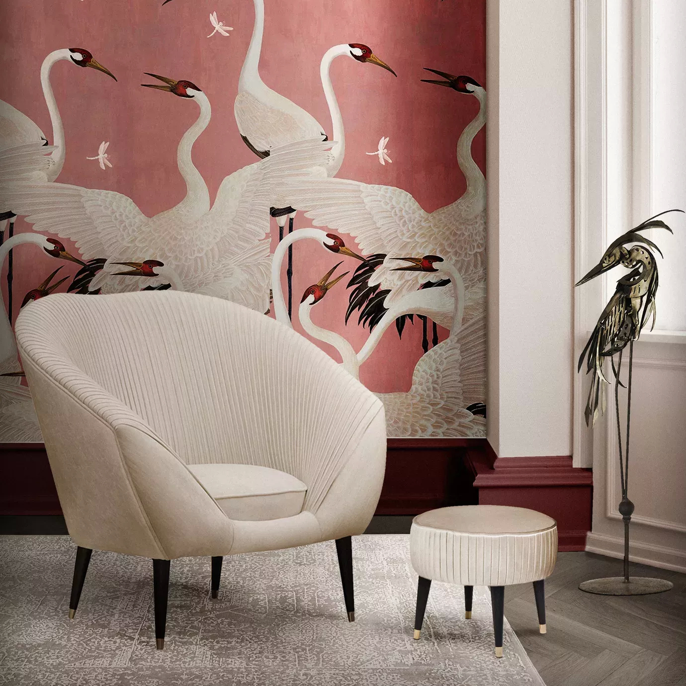 Elegant Audrey Armchair in cream fabric with pleated details and matching footrest in a sophisticated setting with bird-themed wallpaper.