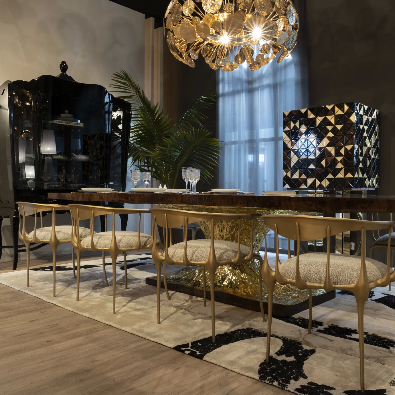 Elegant dining table with a bold, artistic base and a polished, contemporary finish.