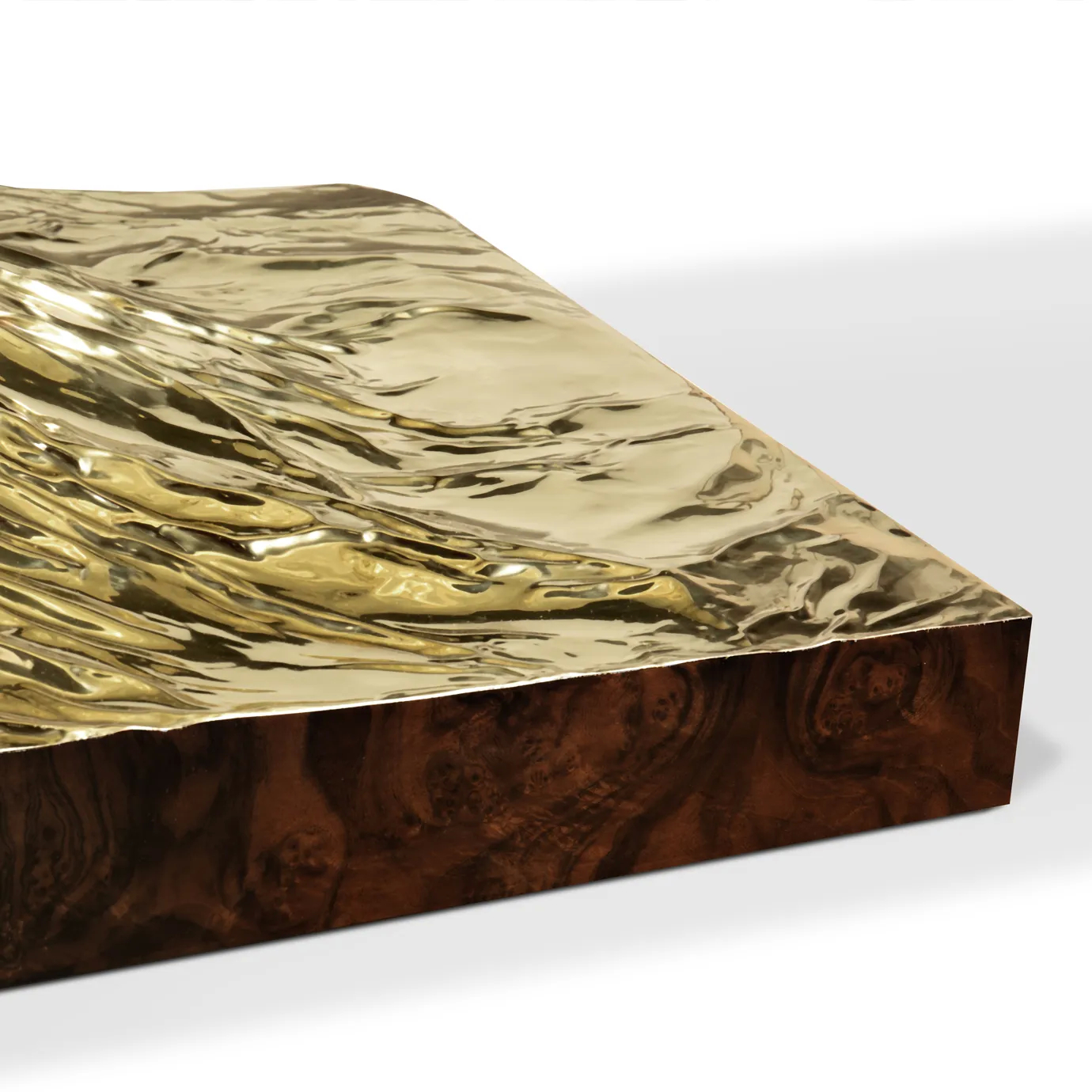 Metamorphosis Dining Table featuring sculpted fossils on a walnut root veneer top.