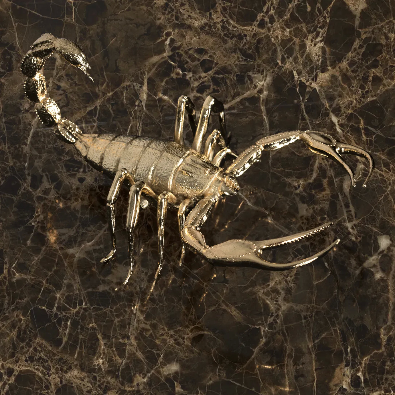 A luxurious center table featuring a glass enclosure with gold-plated scorpions and a marble base.