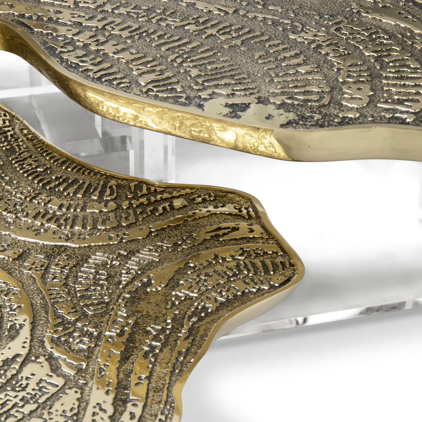 Close-up of the marble top with intricate veining, paired with an elegant gold base.
