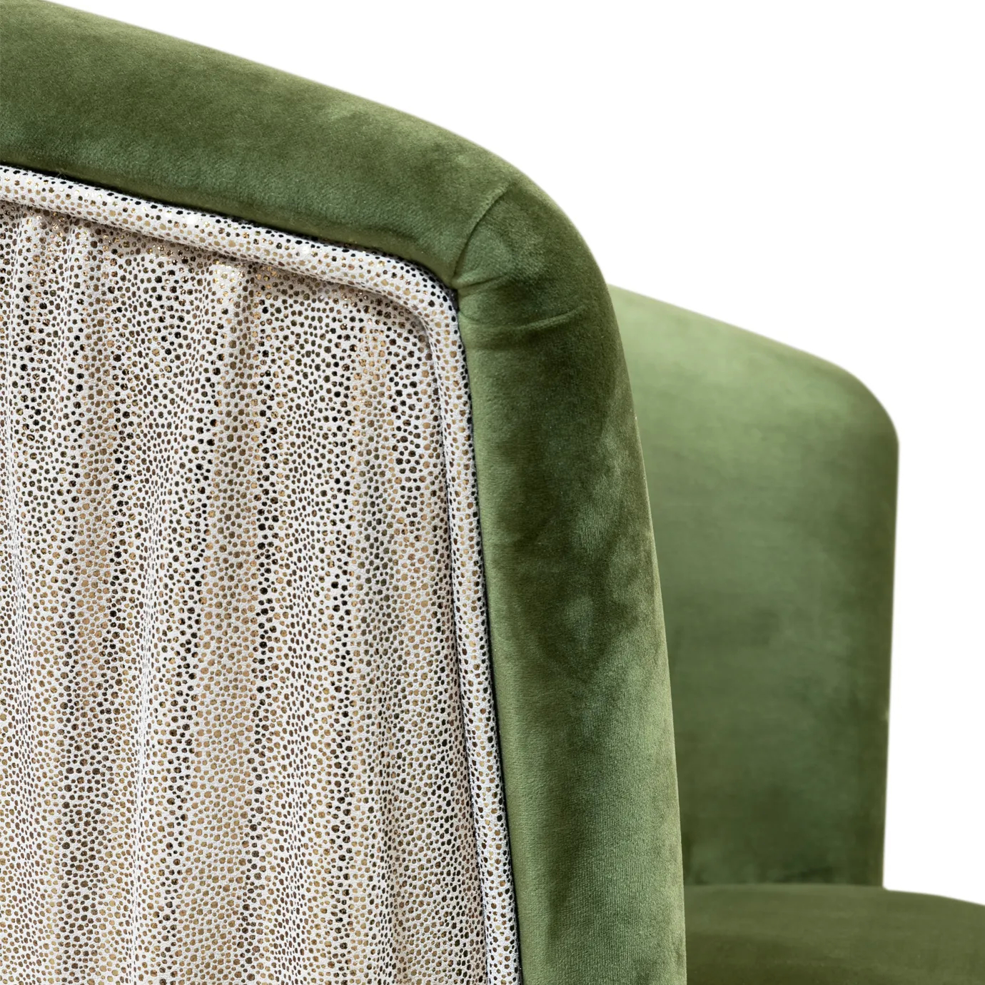 Elegant close-up of the contrast between the green velvet and the textured side detail of the Countess Chair.
