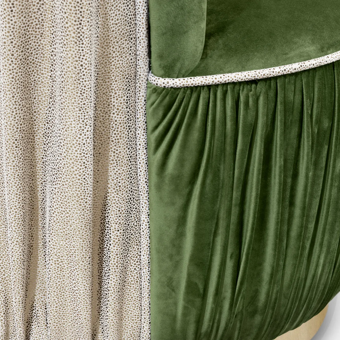 Elegant close-up of the contrast between the green velvet and the textured side detail of the Countess Chair.