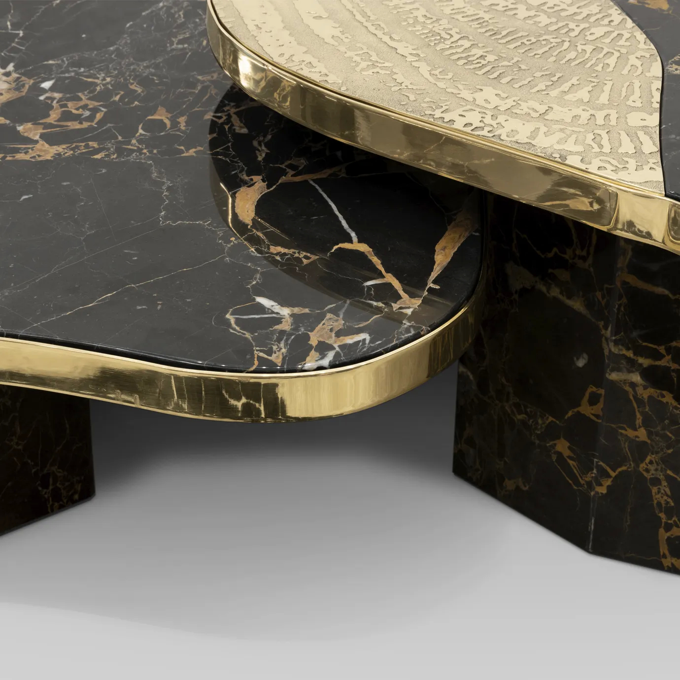 Ophelia center table with Portoro marble top and gold-plated brass base.