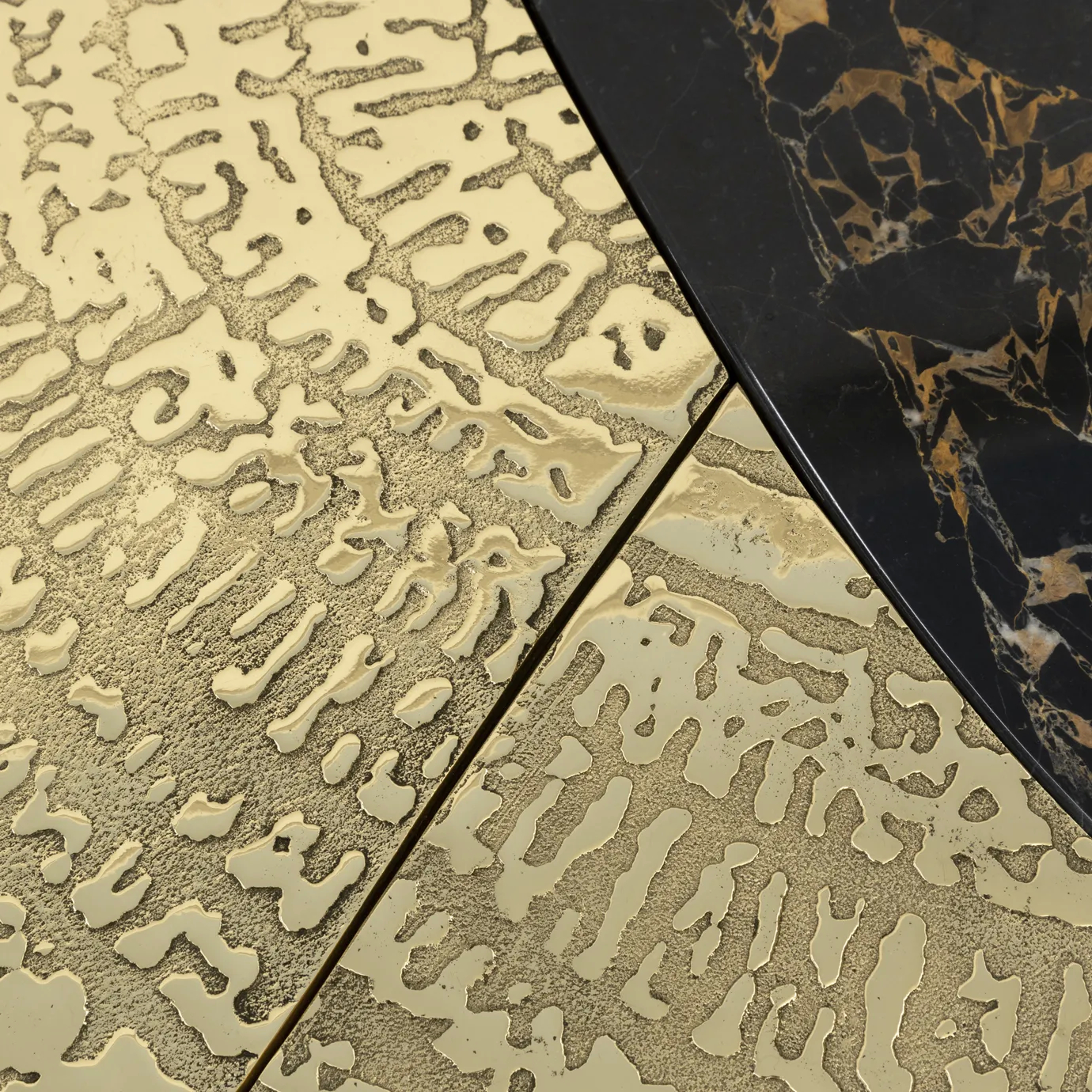 Ophelia center table with Portoro marble top and gold-plated brass base.