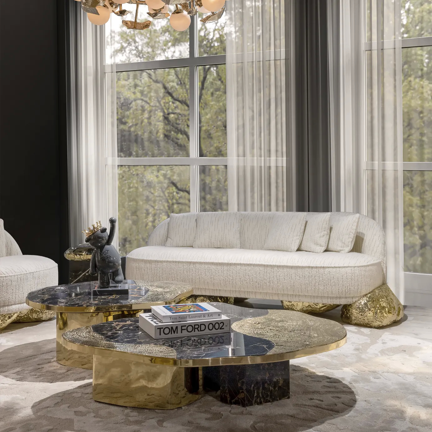 Ophelia center table with Portoro marble top and gold-plated brass base.