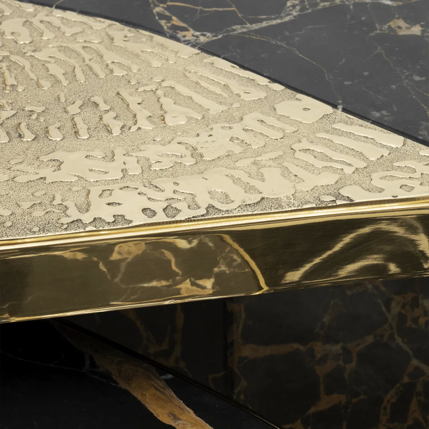 Ophelia center table featuring Portoro marble top and gold-plated brass base.