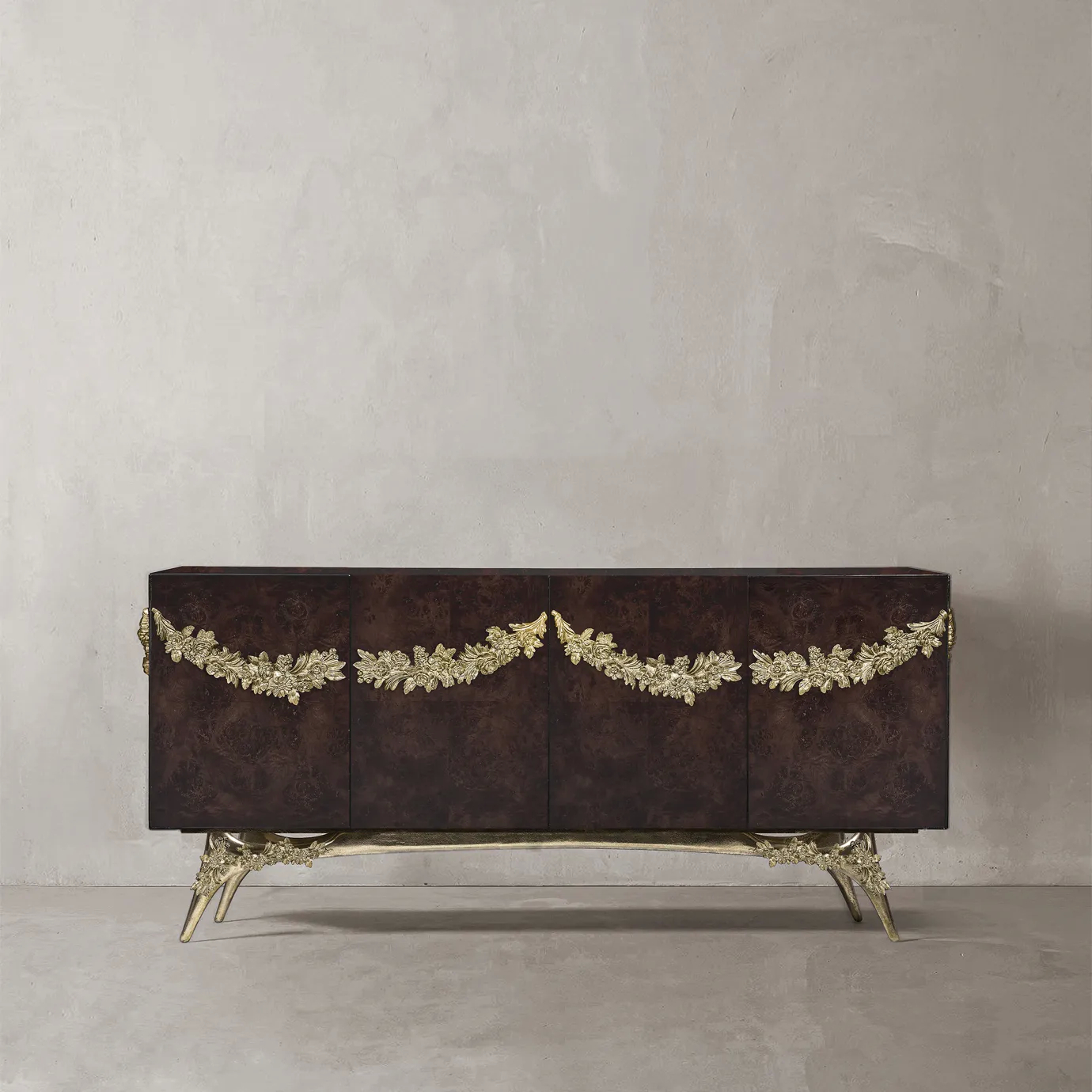 Majestic sideboard with walnut root veneer, gold metal garland, and brass base.