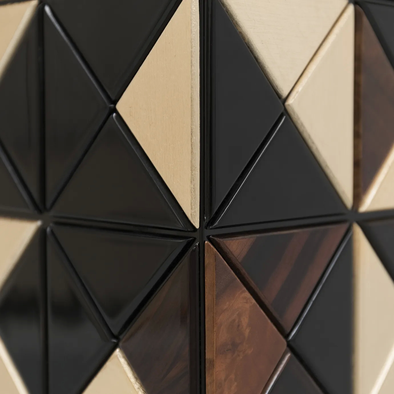 Close-up of Pixel Walnut Cabinet, showcasing intricate geometric pattern with black, gold, and wood tones.