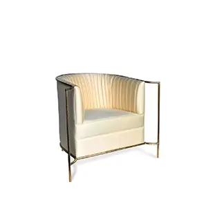 Elegant Desire Chair with golden metal frame and cream fabric upholstery with pleated details.