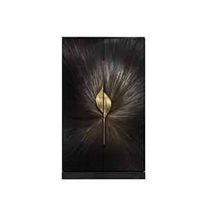 Black and gold armoire featuring a radiant straw marquetry sunburst design and sculptural brass pulls.