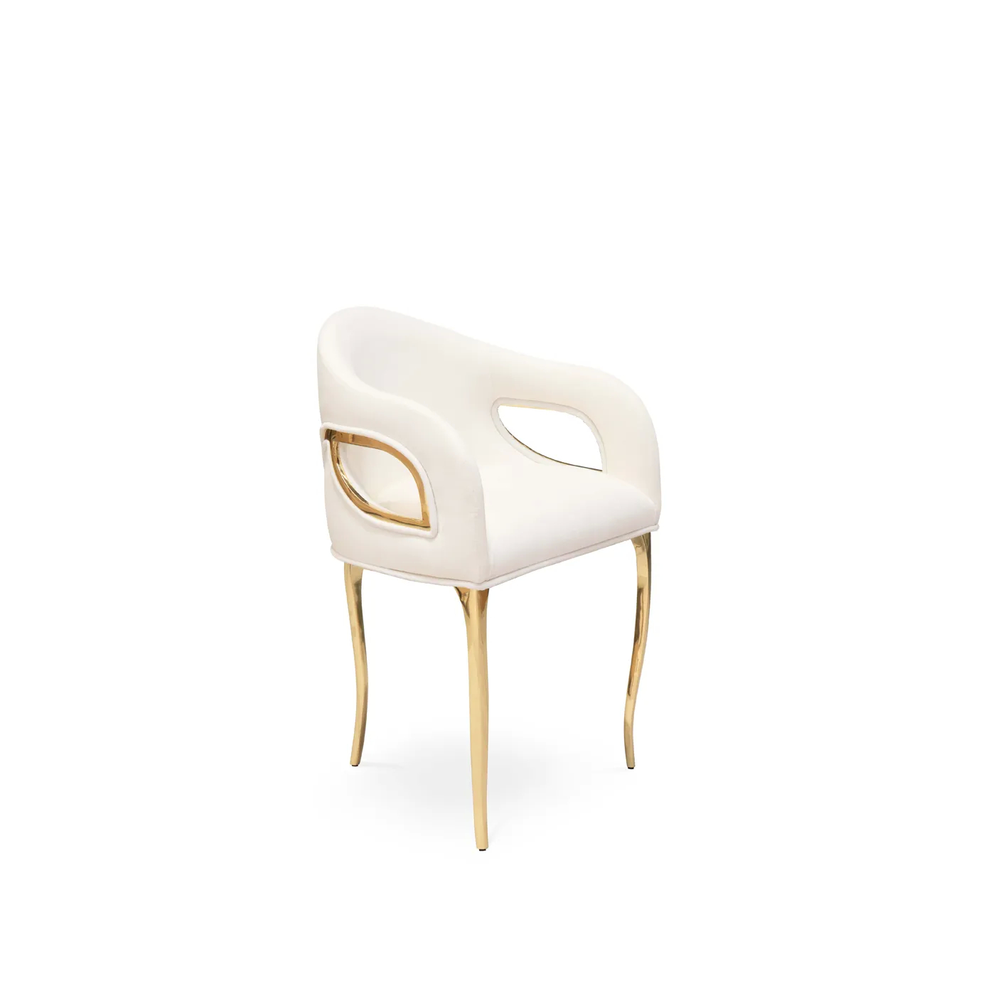 Angled front view of the Chandra Dining Chair in white by KOKET, showcasing its soft upholstery, open backrest, and polished brass legs.