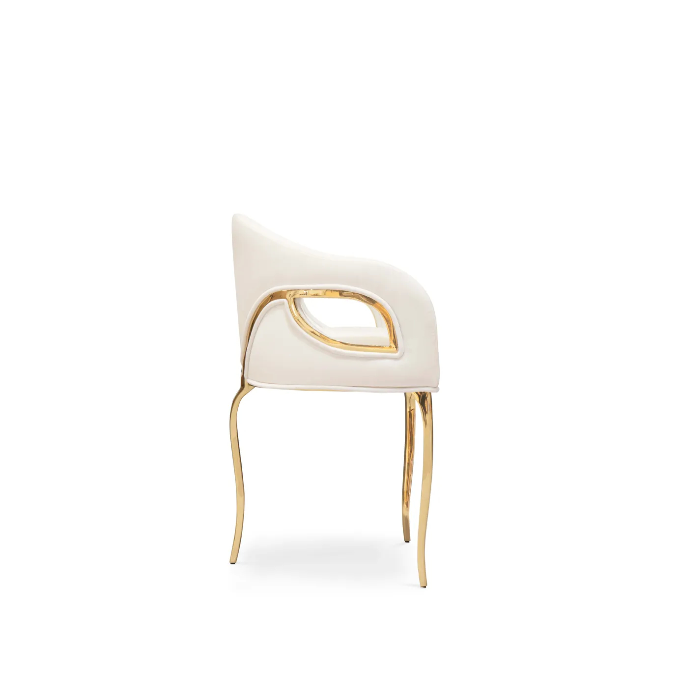 Side view of the Chandra Dining Chair in white by KOKET, featuring a sleek brass base and an elegantly curved upholstered seat with an open back design.