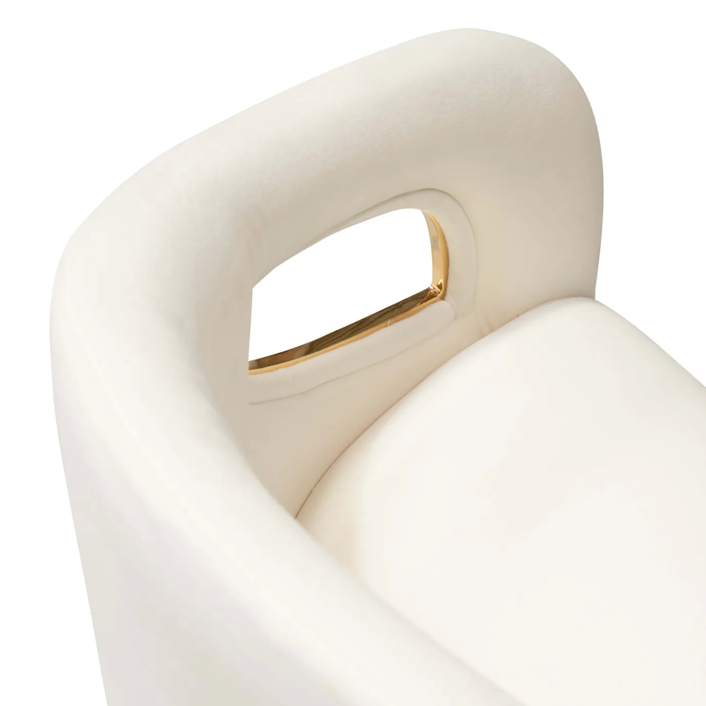 Close-up of the Chandra Dining Chair in white by KOKET, focusing on the luxurious upholstery and the curved brass frame wrapping around the seat.