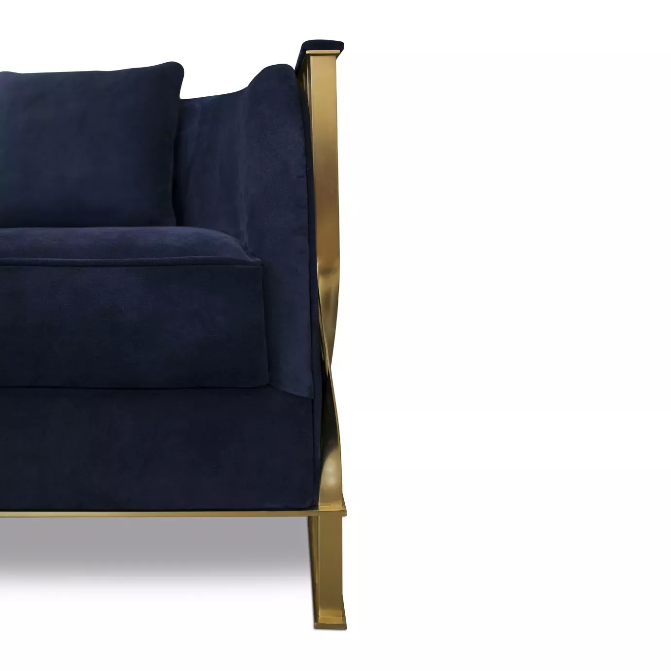 Elegant close-up of the golden satin brass frame and deep blue velvet upholstery of the Mandy Armchair.