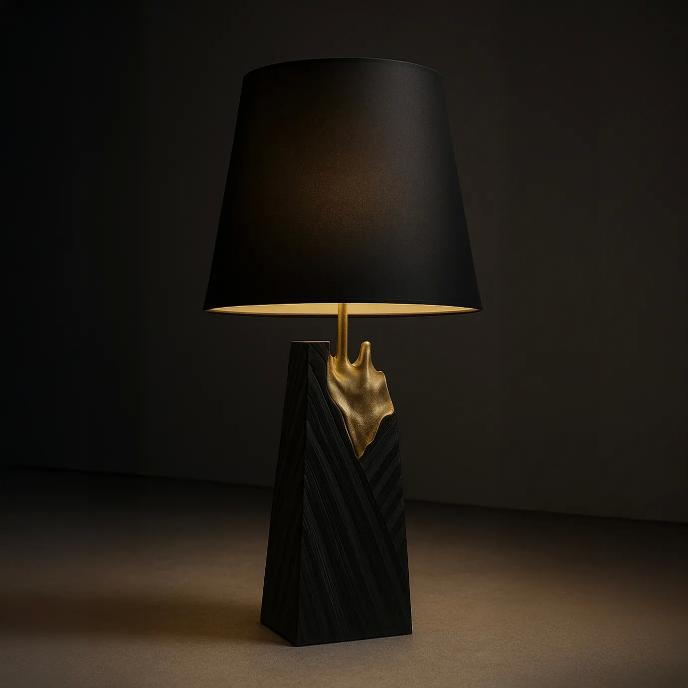 A luxurious Gild Table Lamp casting a warm glow, featuring a black shade, a textured black base, and a striking gold accent.