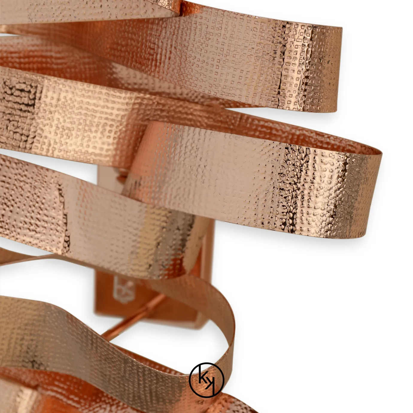 Elegant Chloe Sconce with a sculptural design of wavy ribbons in a textured copper tone.