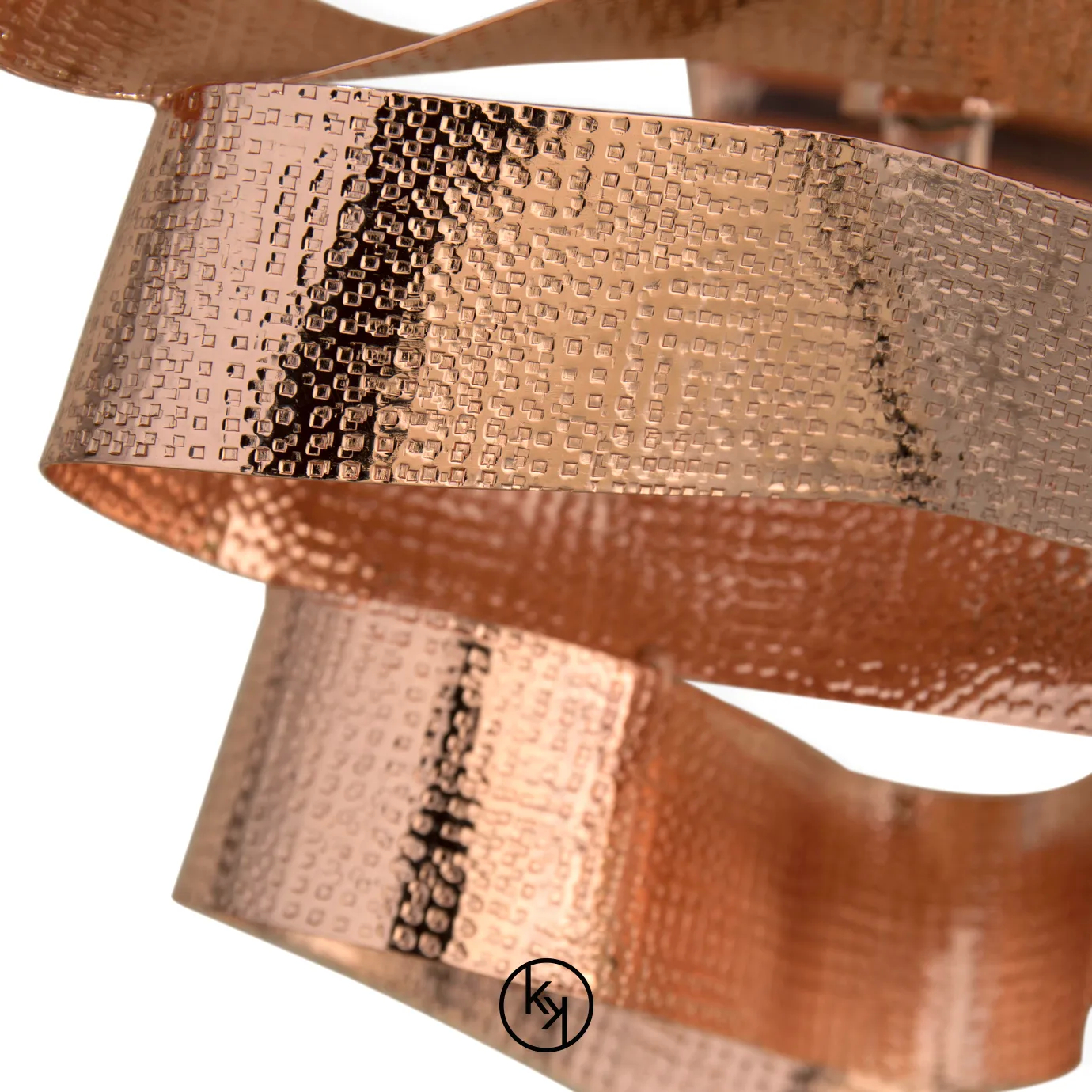 Elegant Chloe Sconce with a sculptural design of wavy ribbons in a textured copper tone.