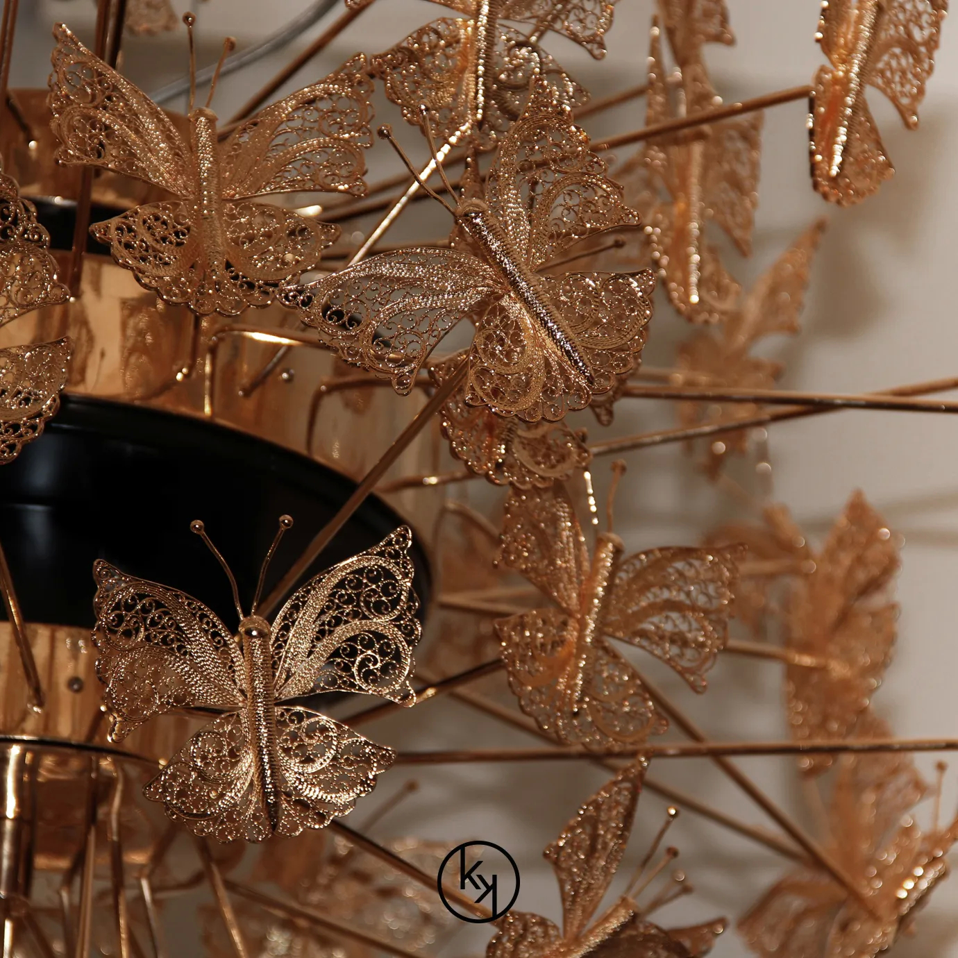 The Nymph Chandelier is inspired by butterflies, with multiple representations of this rare and beautiful animal in golden hues hovering in the air.