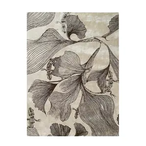 Full view of KOKET Flora rug in sepia and cream tones. Luxury area rug with artistic ginkgo leaf patterns and reptile-inspired details in bronze silk-like texture.