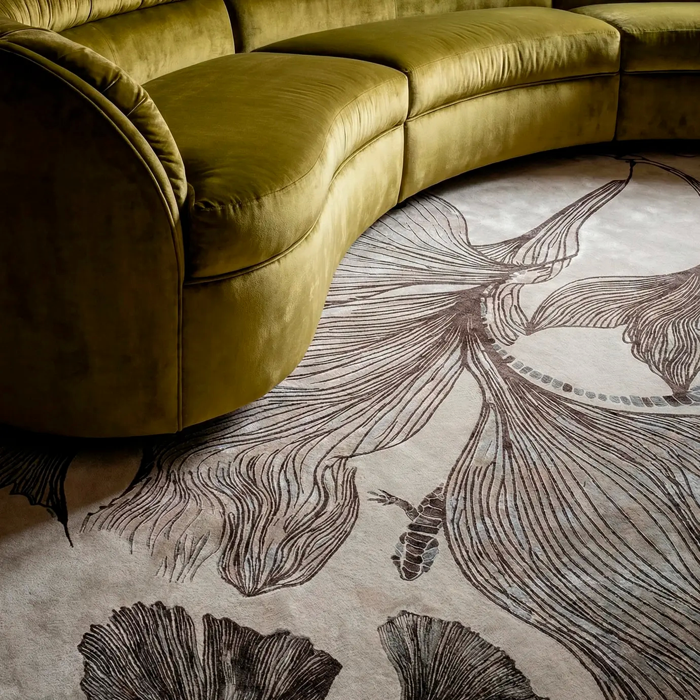 Detailed view of the KOKET Flora Grey luxury rug featuring hand-tufted botanical patterns and intricate lizard motifs in a sophisticated grey and cream palette.