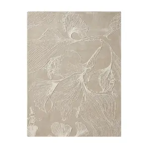 KOKET Flora luxury rug in a monochromatic nude palette. High-end hand-tufted rug with 3D botanical relief and ginkgo leaf pattern for contemporary neutral interior design.