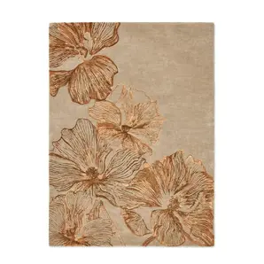 Full view of KOKET Poppy luxury rug in beige and bronze. High-end floral area rug featuring oversized poppy flower motifs with shimmering metallic textures and hand-tufted details.