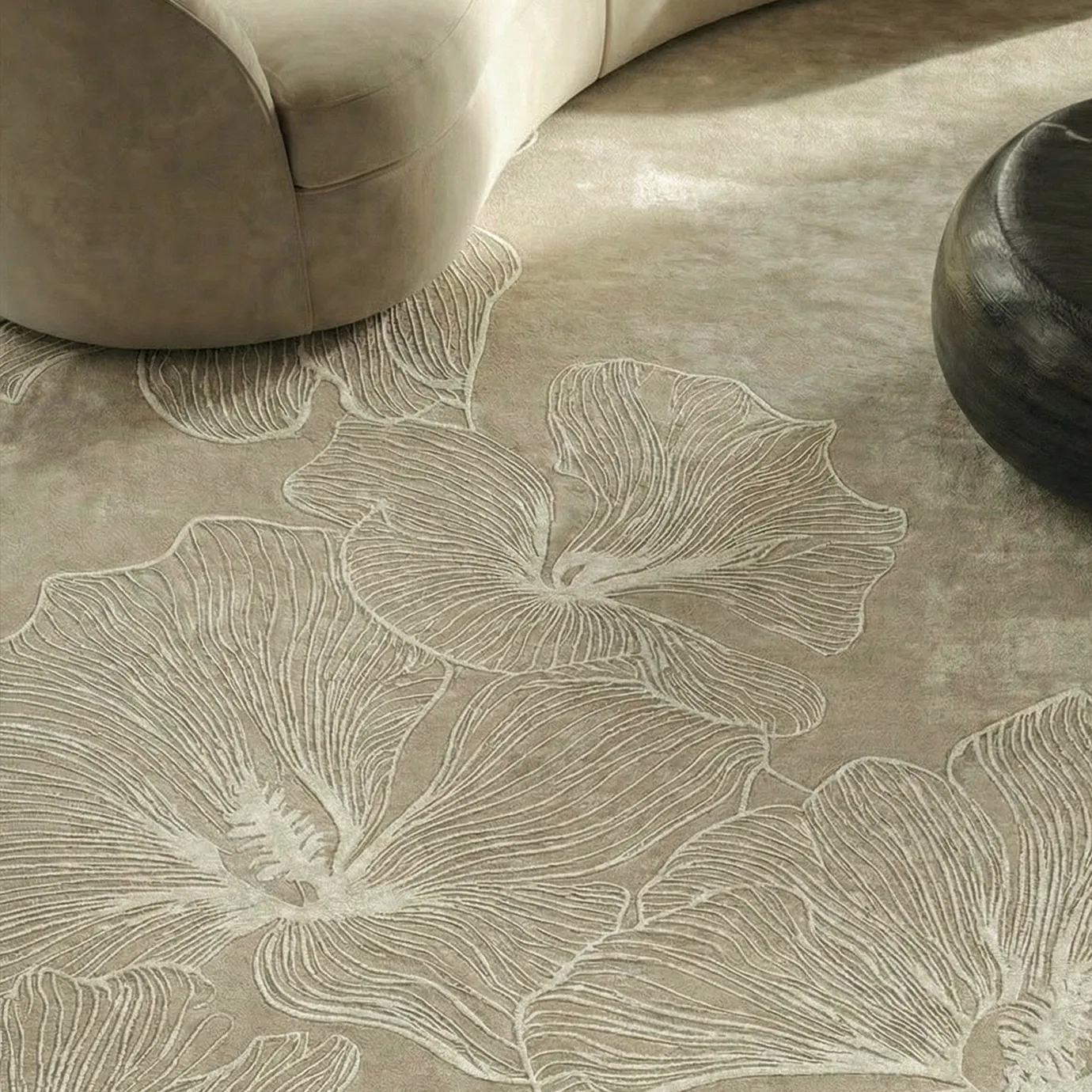 Poppy Sand Rug by KOKET with sculptural poppy floral motif in raised ivory lines on soft sand background
