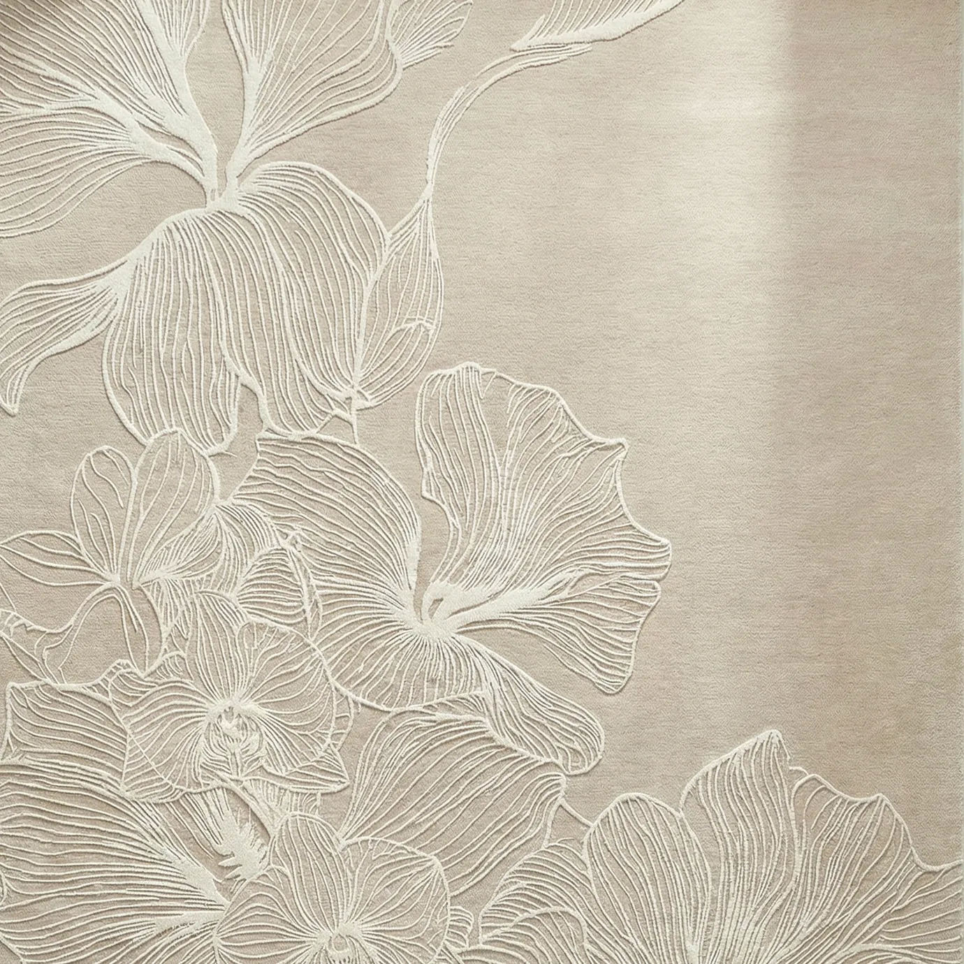 Poppy Sand Rug by KOKET close-up with sculptural poppy floral pattern in raised ivory lines on sand-toned base