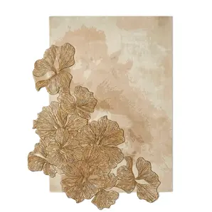 Full view of the KOKET Hibiscus luxury rug featuring an organic arrangement of hand-tufted ginkgo leaves with a metallic bronze finish on a neutral beige background.